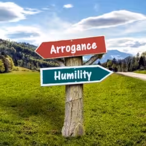 Signpost pointing to Arrogance and Humility in countryside