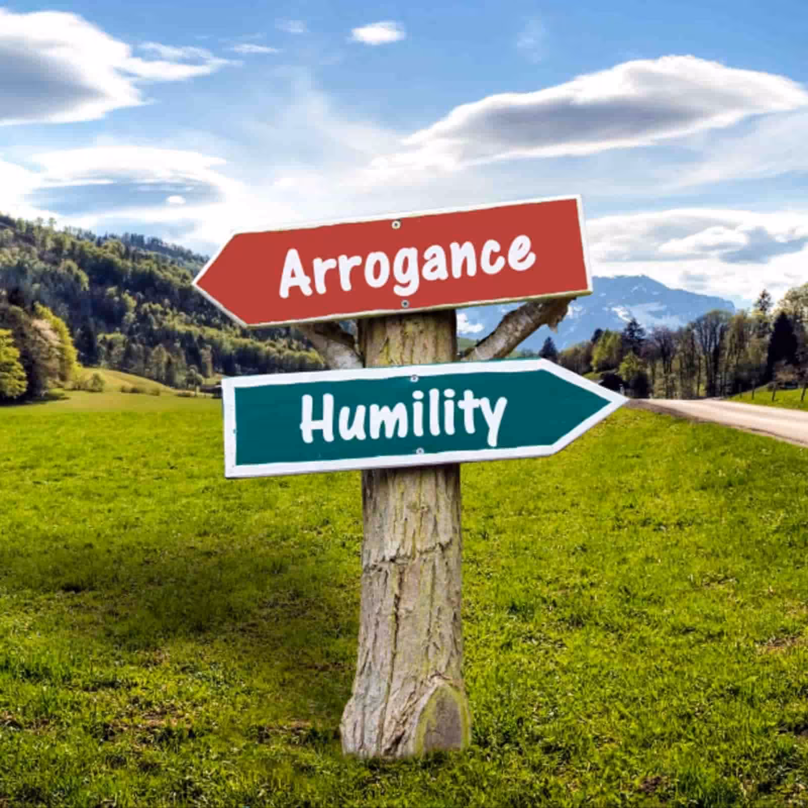 Signpost pointing to Arrogance and Humility in countryside